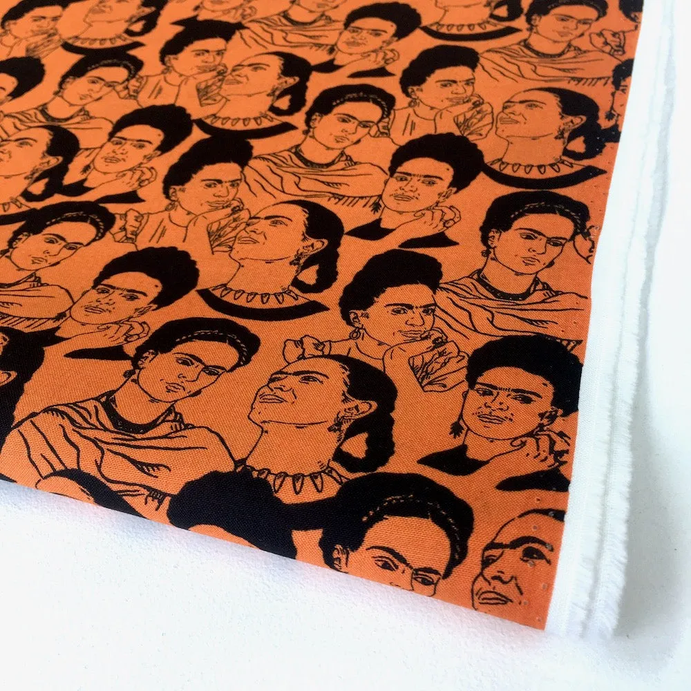 Robert Kaufman Licensed Frida Kahlo Mono Faces Orange (Per Metre)