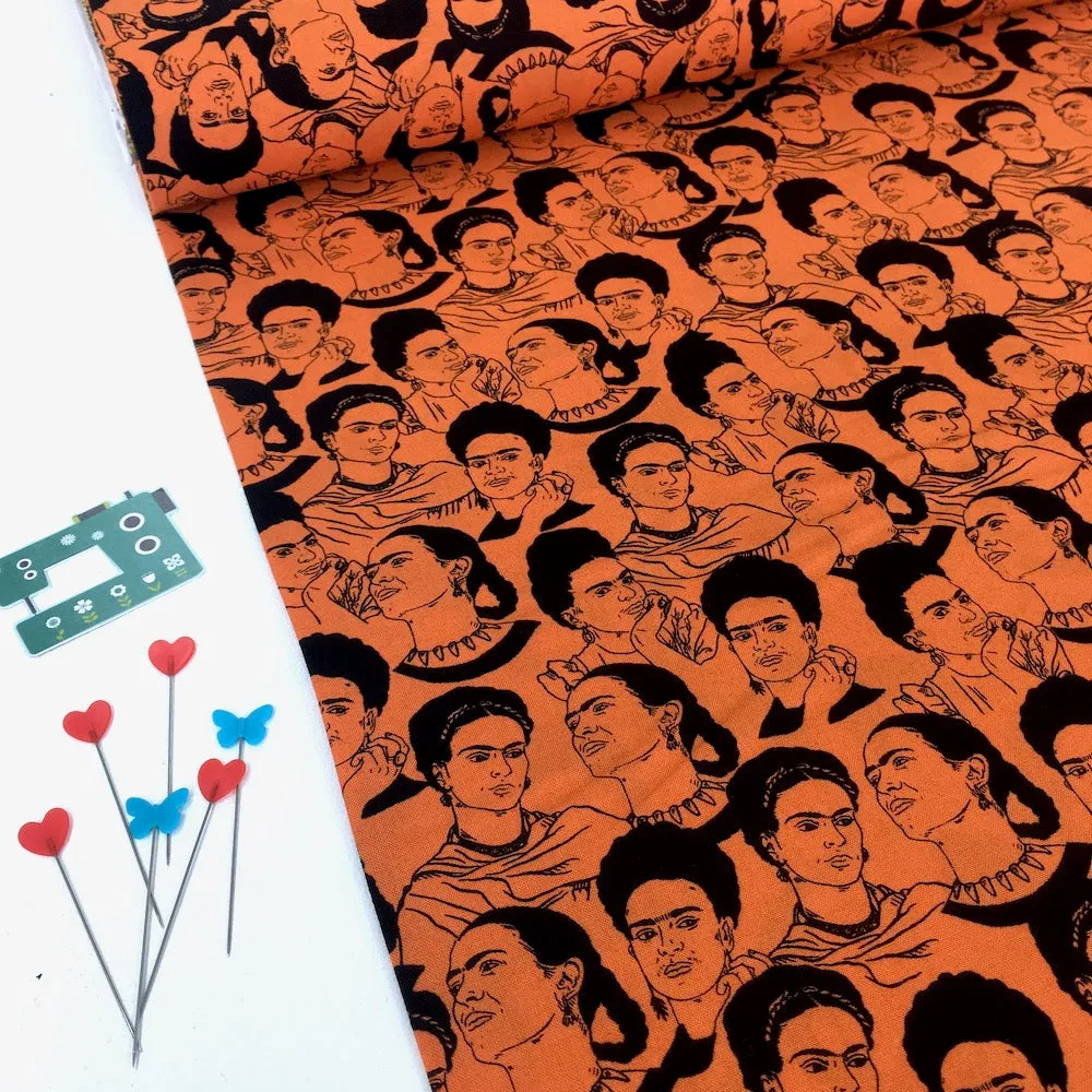Robert Kaufman Licensed Frida Kahlo Mono Faces Orange (Per Metre)